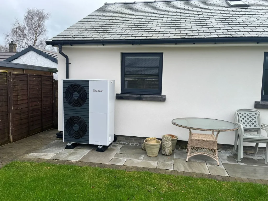 Newly installed air-source heat pumps outside home in garden