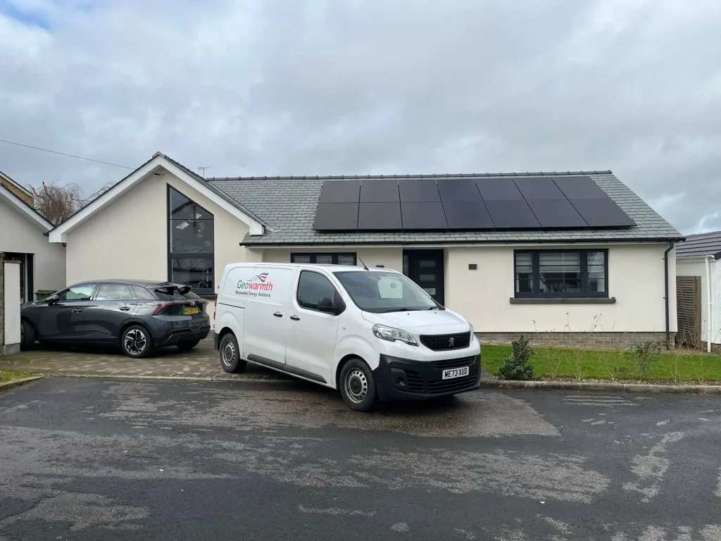 Geowarmth branded van outside home with solar panels newly installed