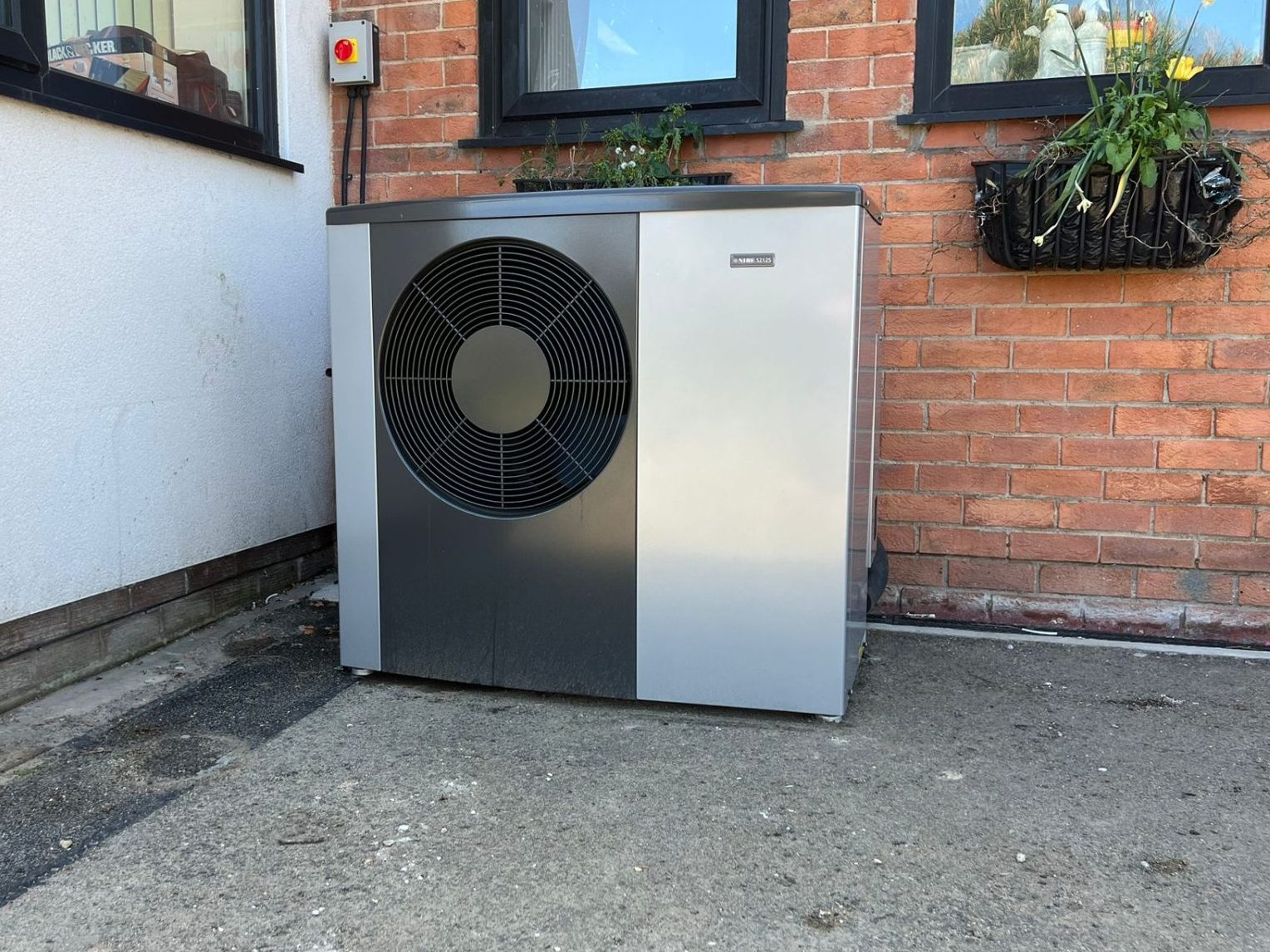 Close up photo of newly installed heat pump outside
